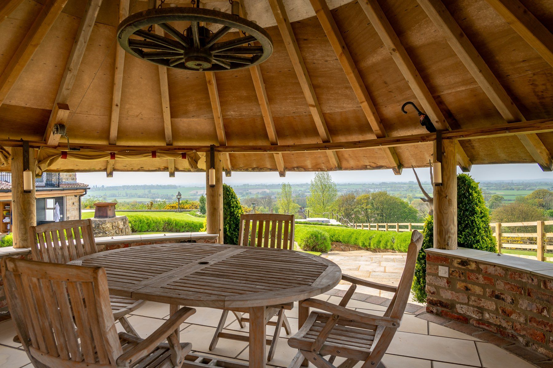 Oak-beamed summer house set for outdoor dining