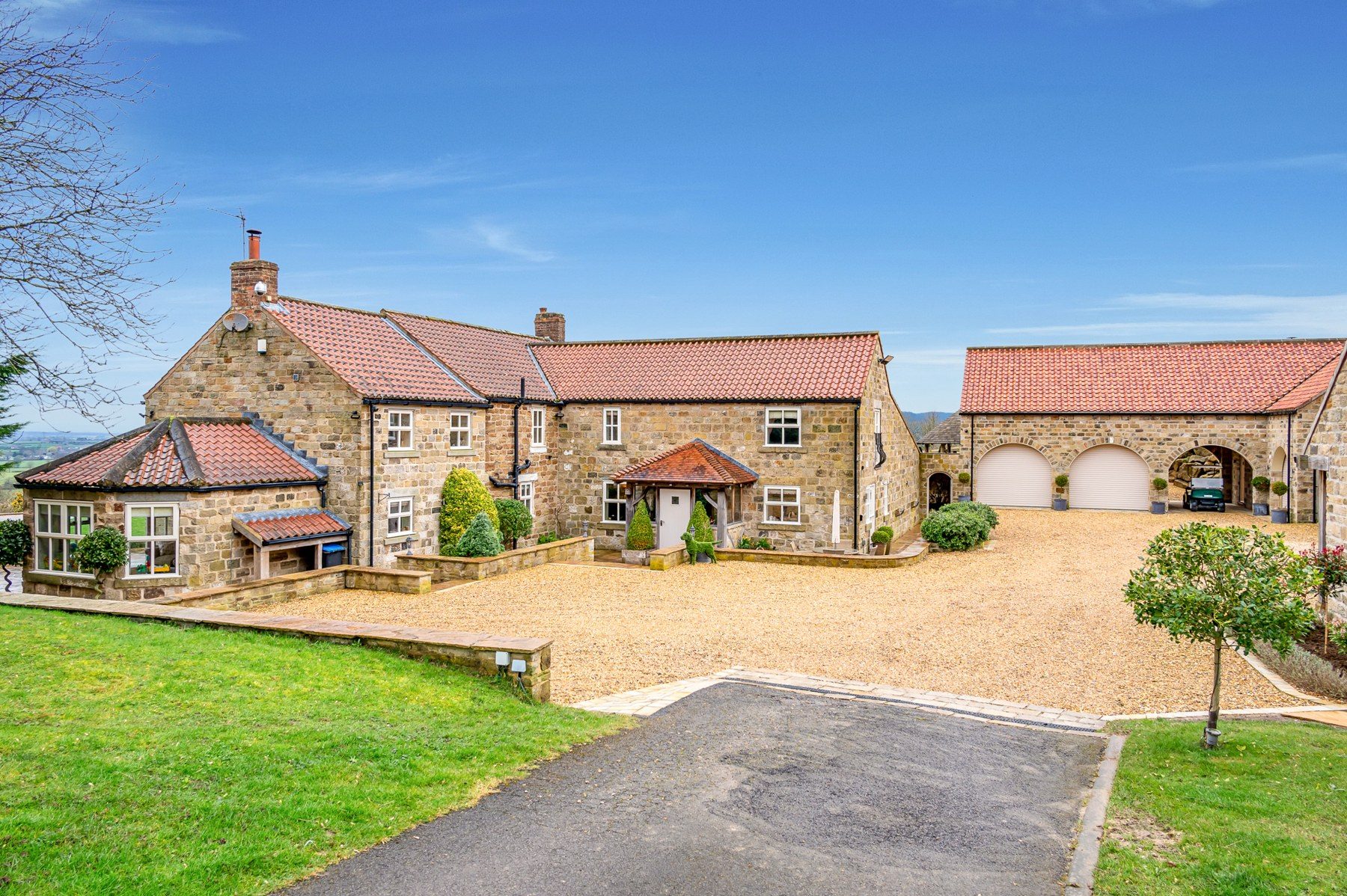 The cottage and outbuildings seen from the courtyard