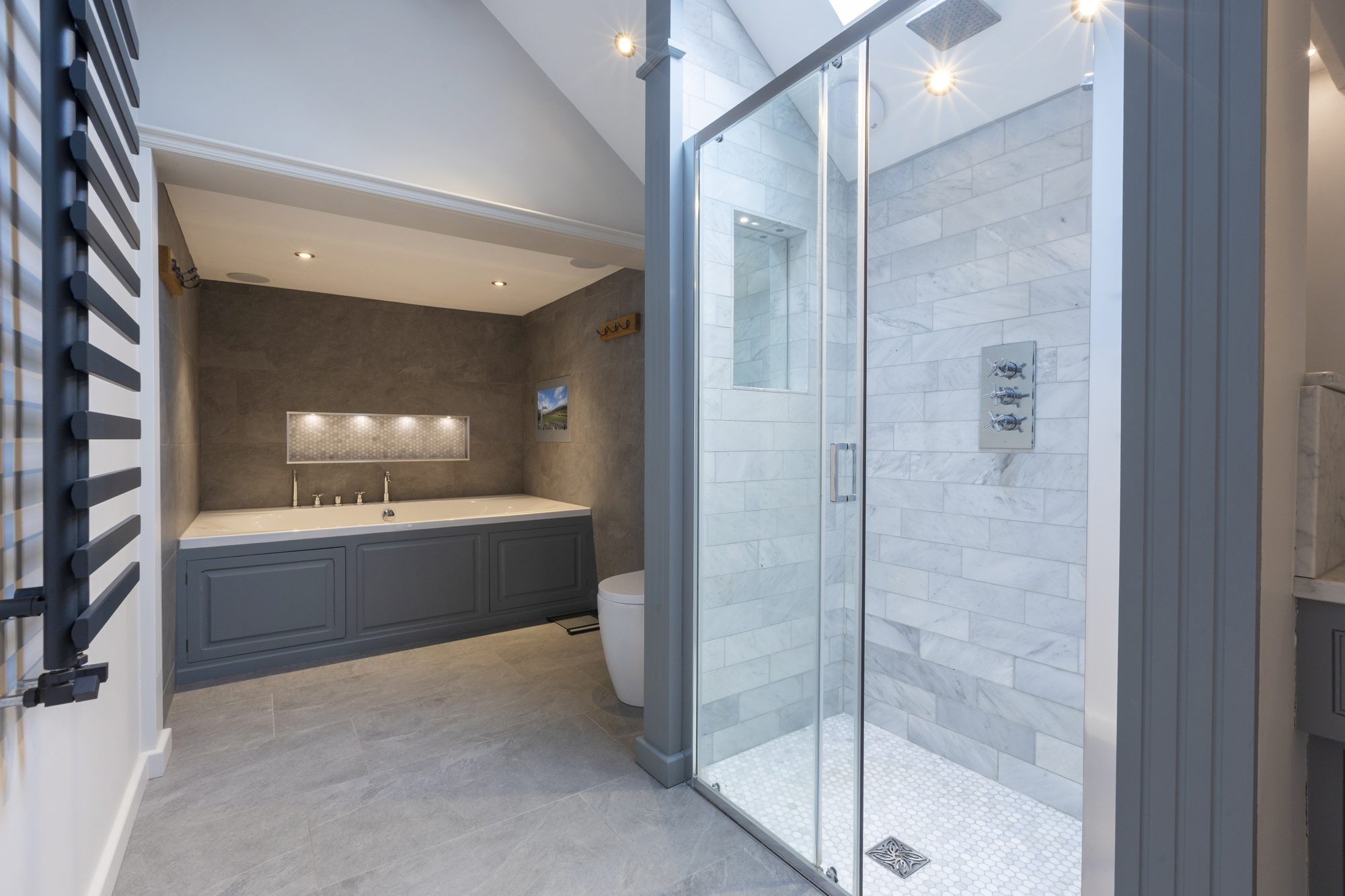En-suite with walk-in shower and panelled bath
