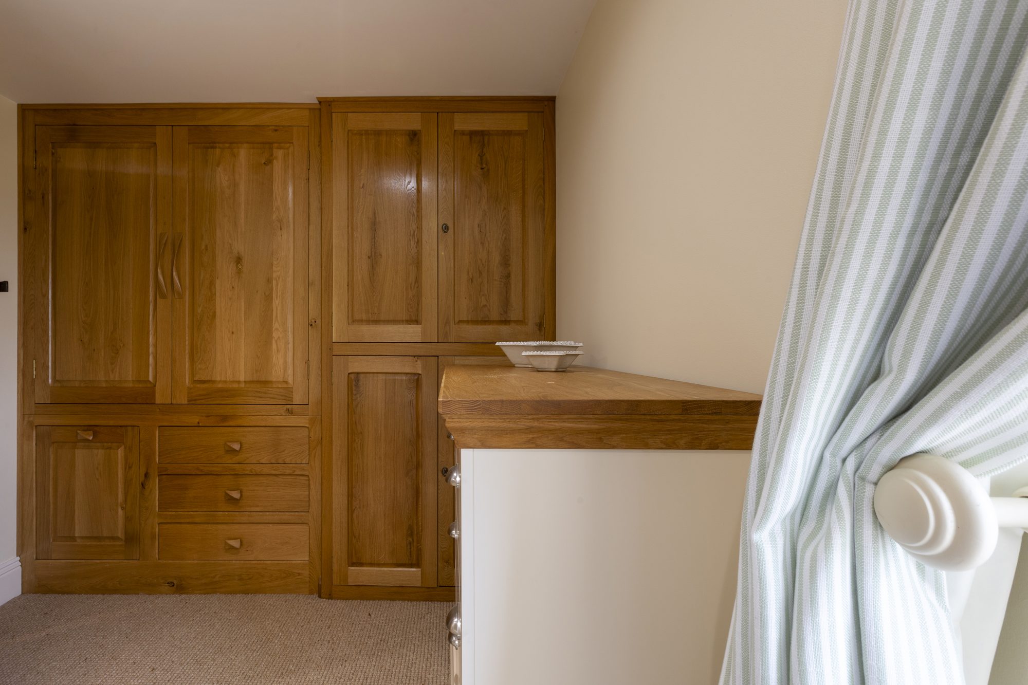 Dressing room with fitted oak wardrobes