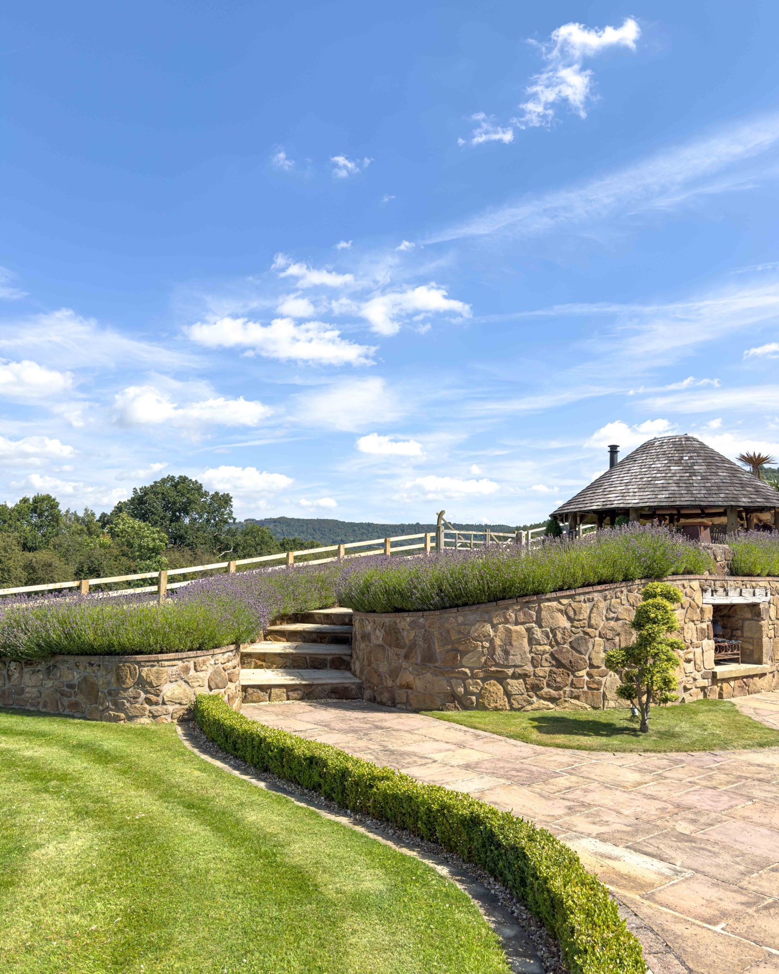 Lavender-lined stone steps up the terraced garden