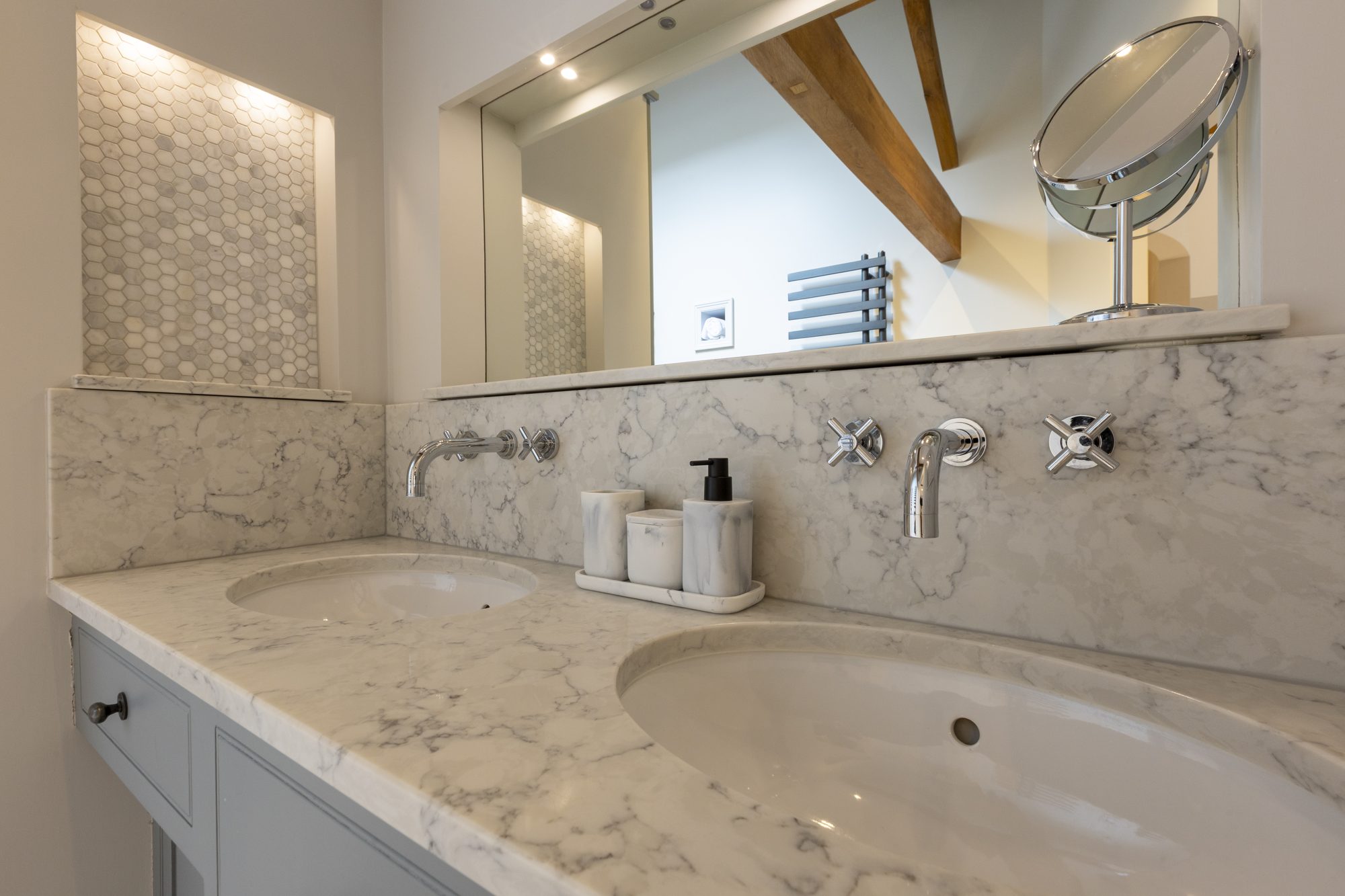 Marble-topped vanity with mosaic tiling