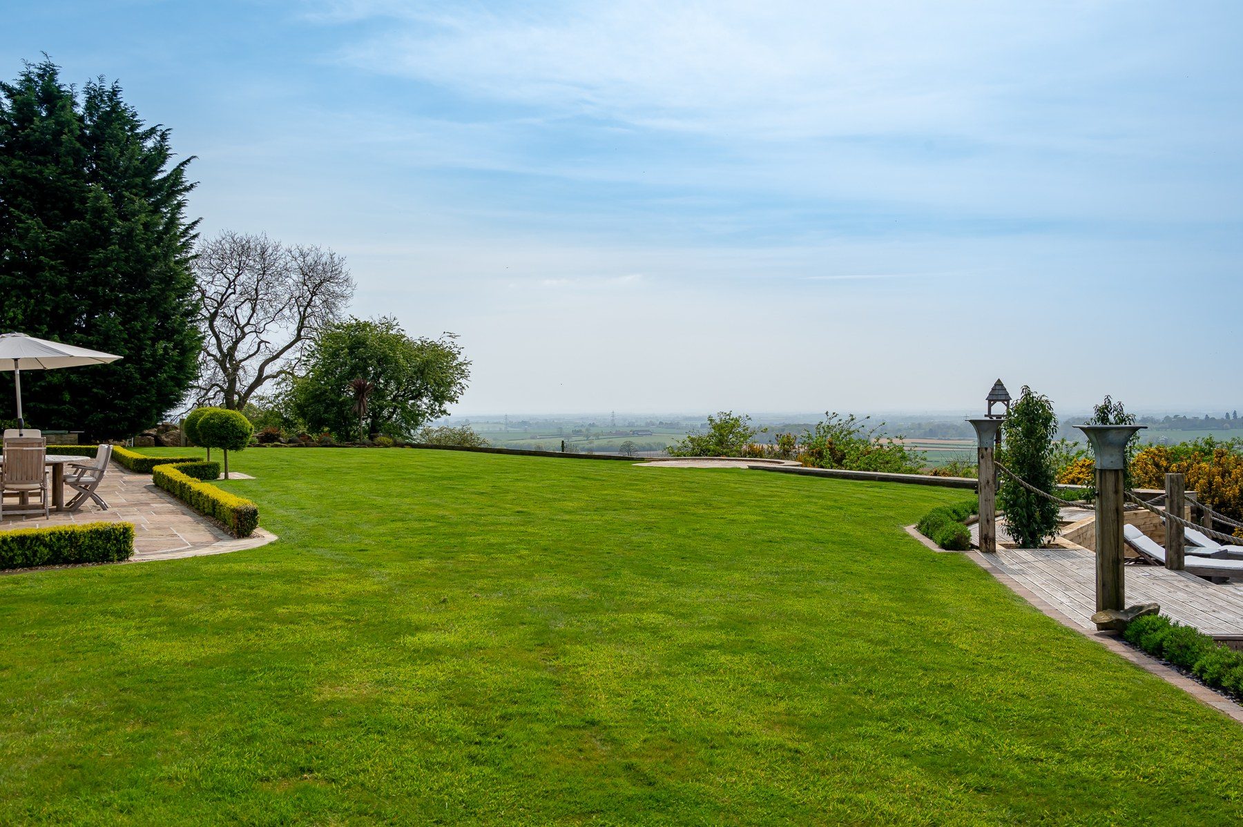 Lawn falling away to the Vale of York