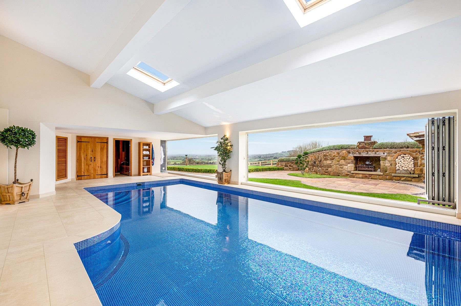 Private indoor heated swimming pool with vaulted ceiling