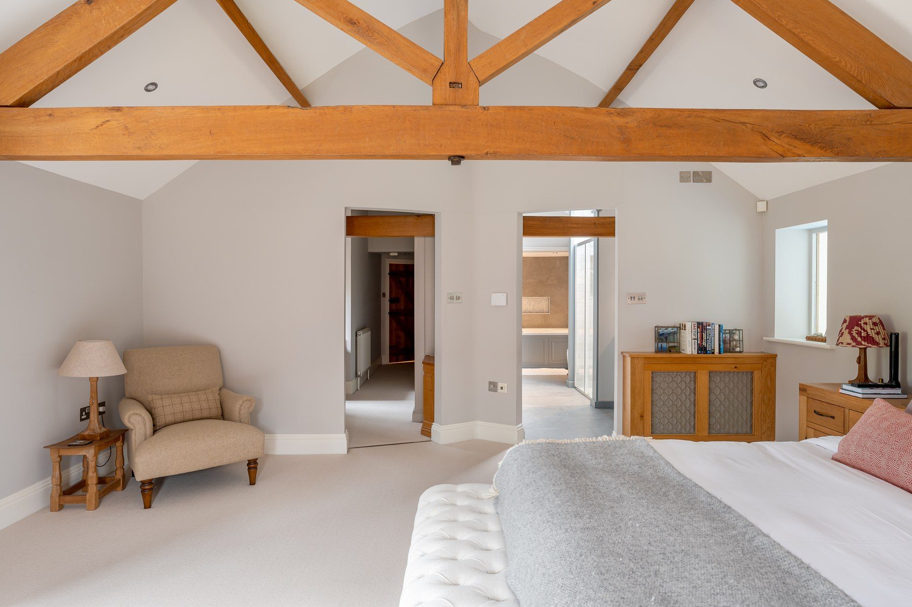 The master suite with its seating area and en-suite beyond
