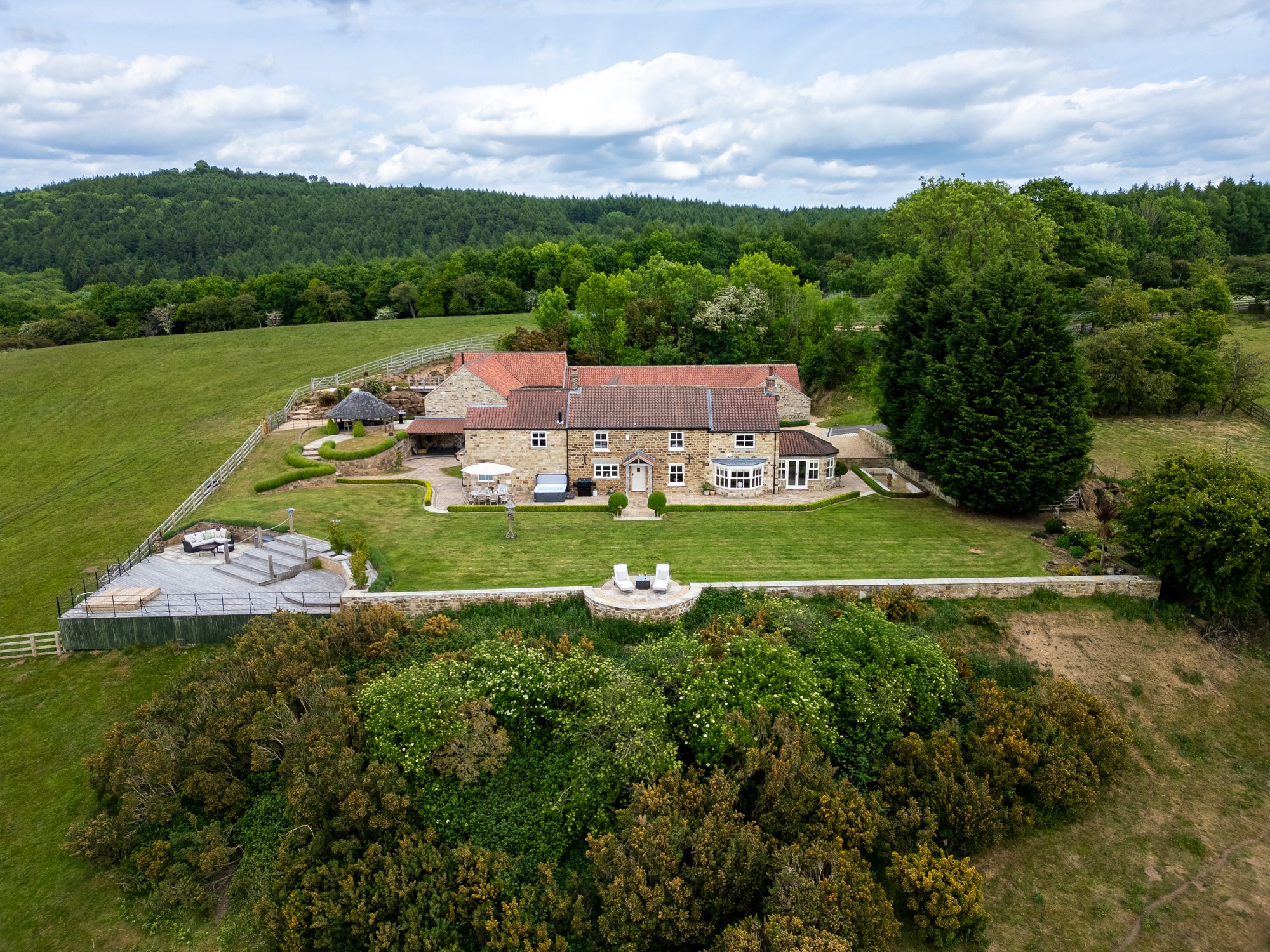 Aerial view of the house, pool and gardens from above
