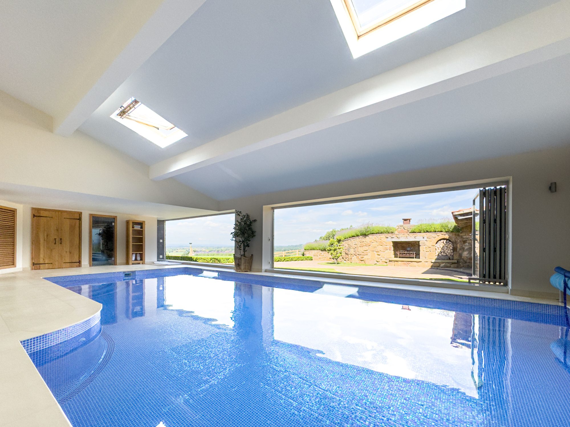 The heated pool under its roof lanterns