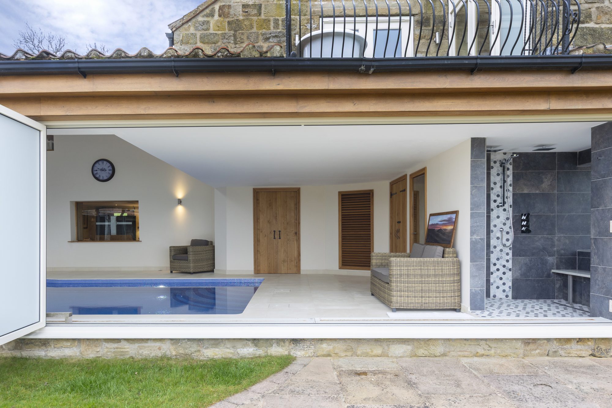 The indoor pool seen from the open terrace doors
