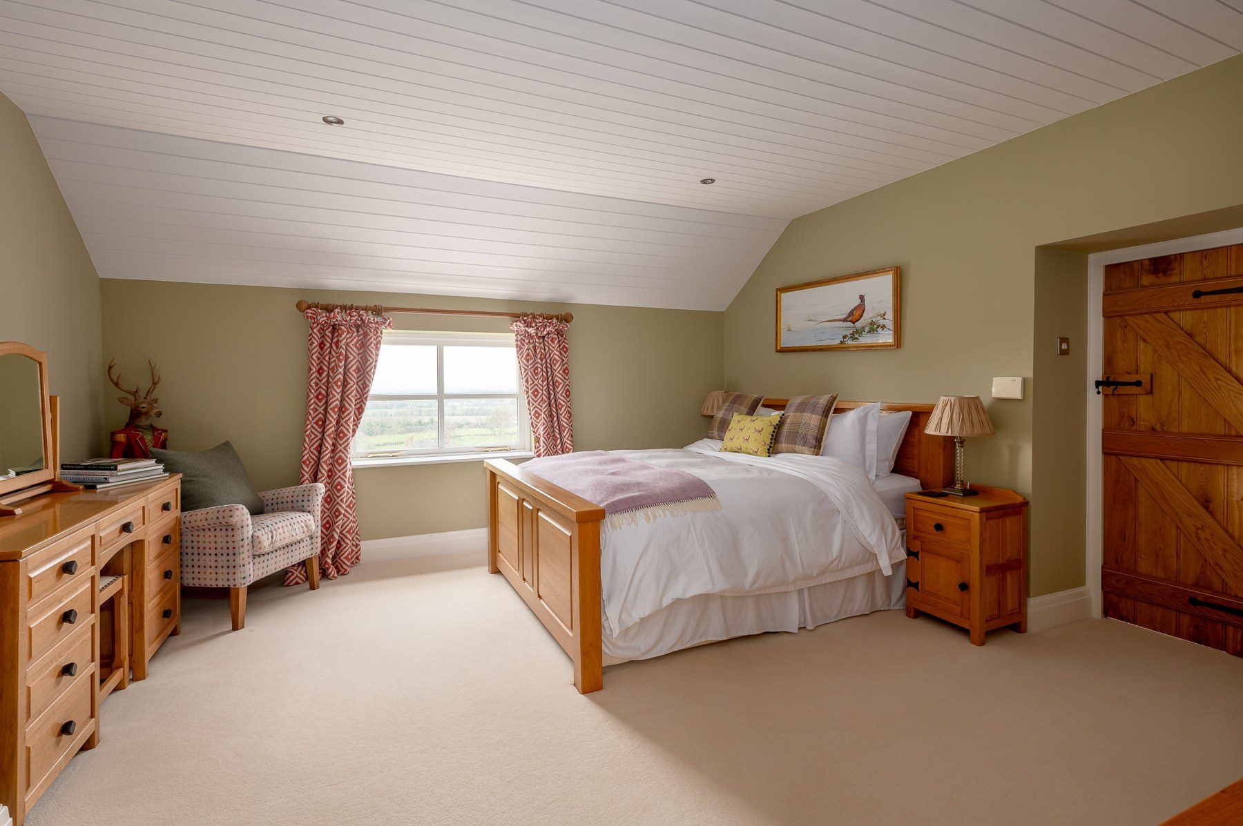 Bedroom 3 with oak bed, window seat and countryside view