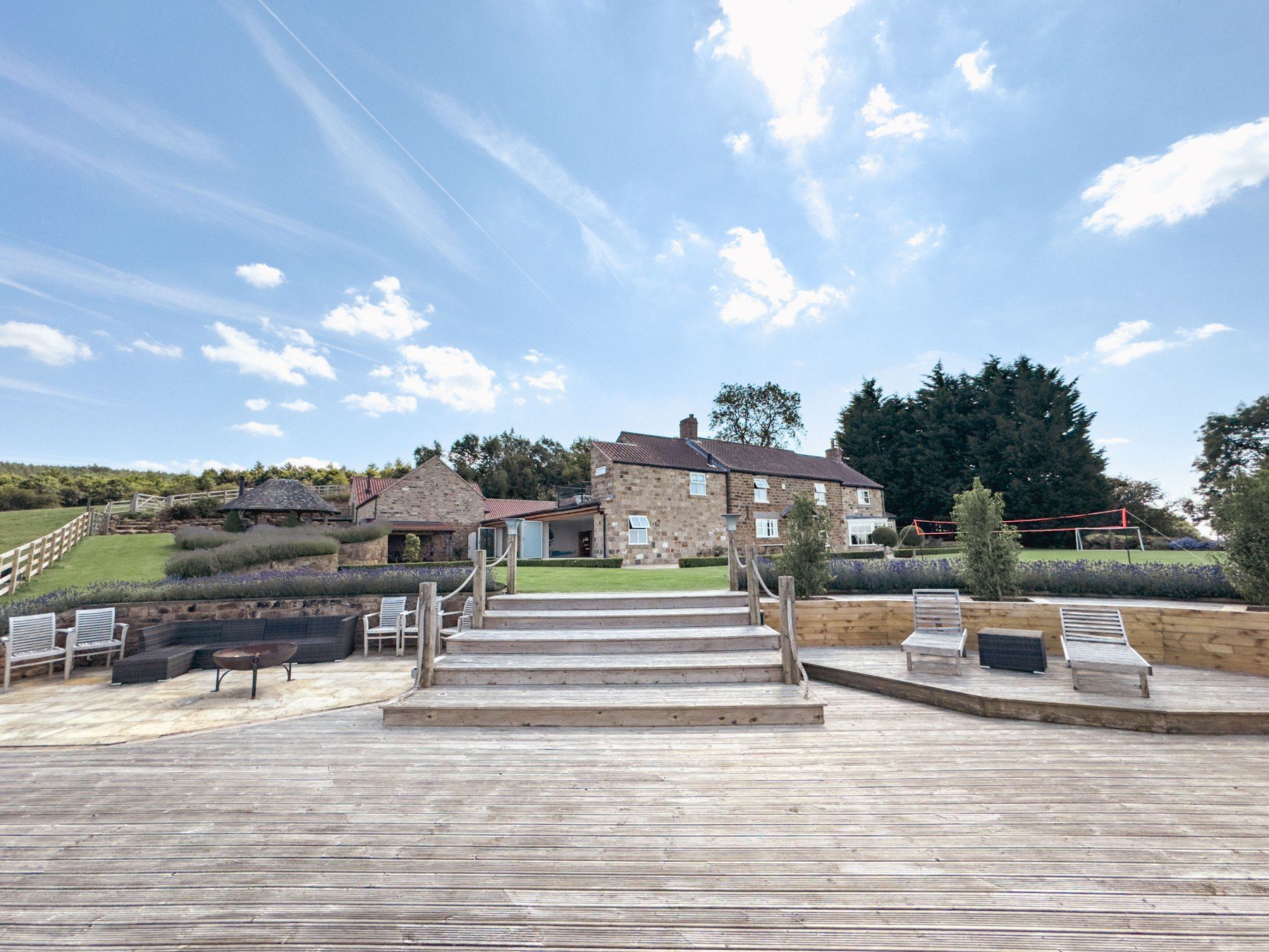 Wide steps from the terrace up to the house