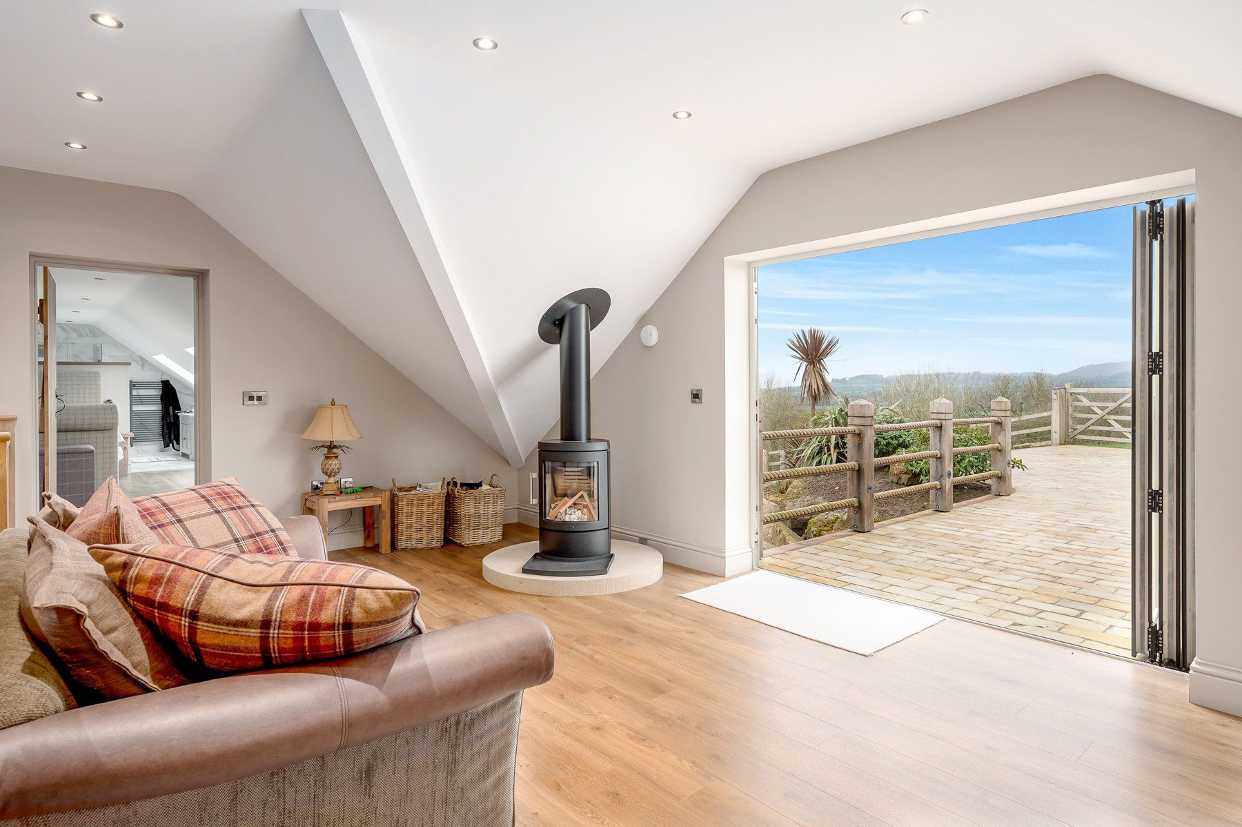 Snug with bi-fold doors open to the sun deck
