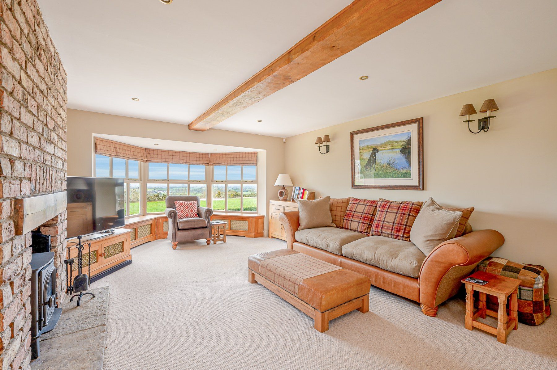 Bay-windowed sitting room with countryside outlook