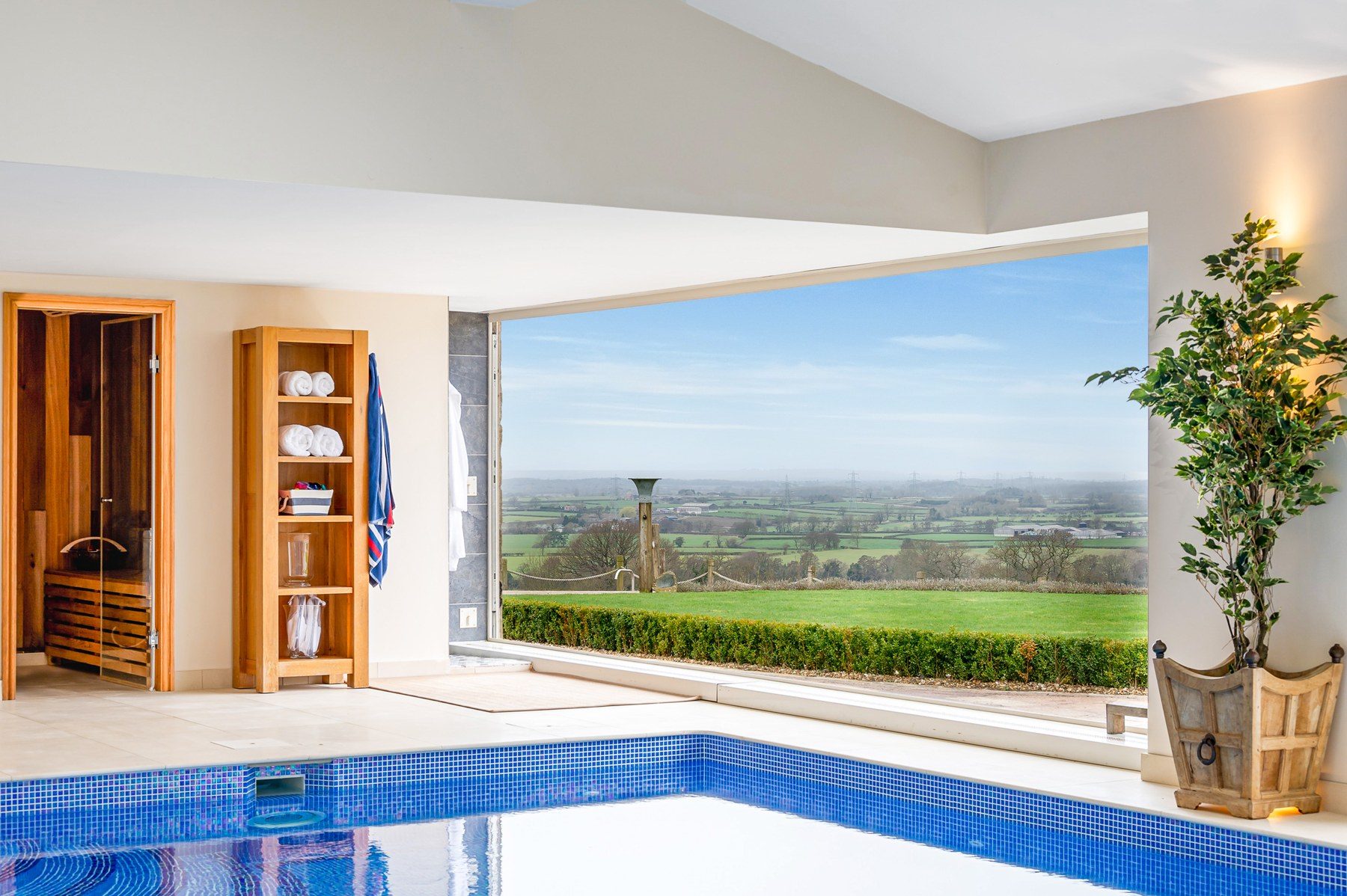 Pool room fully open to the garden and far views