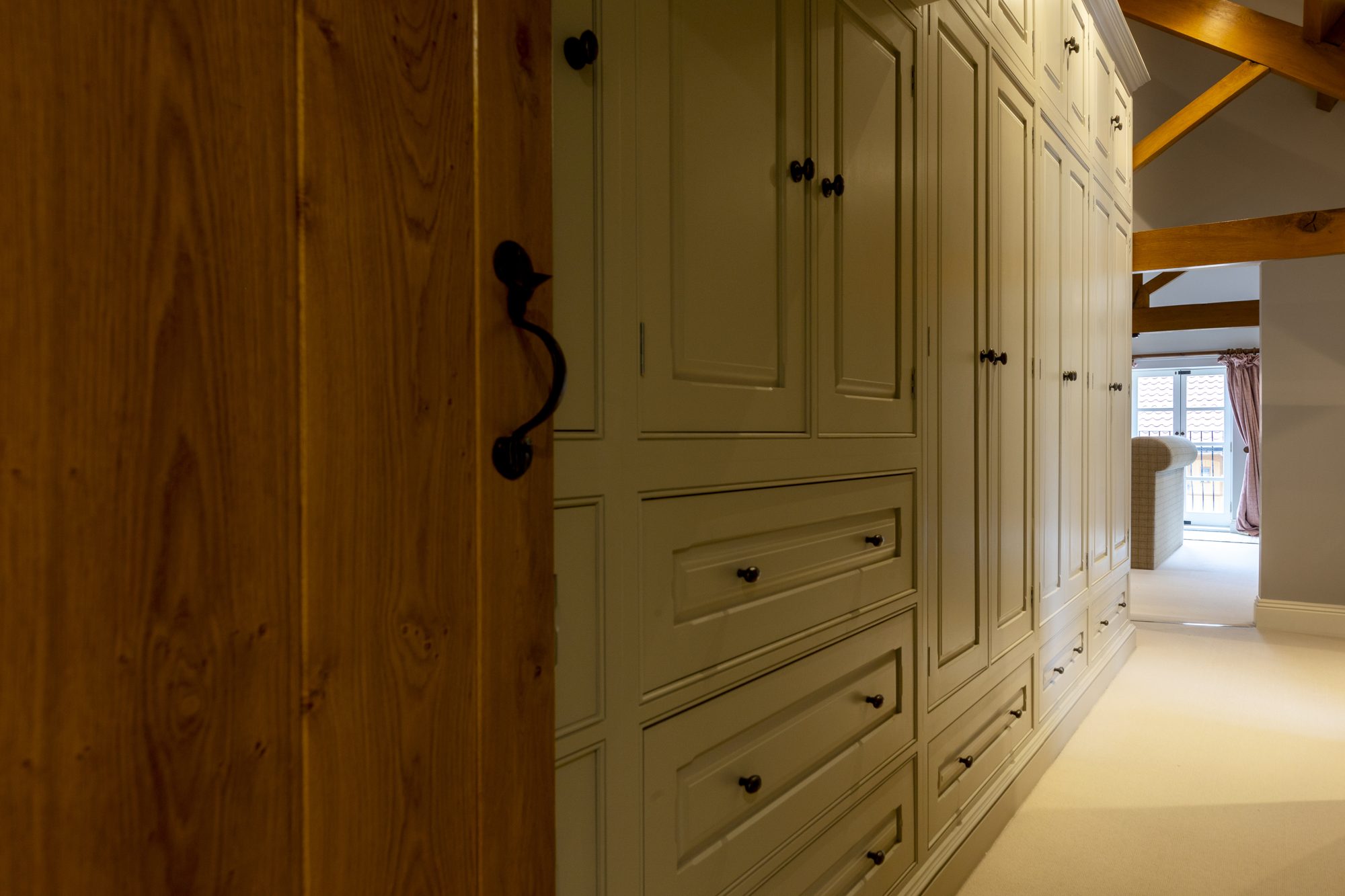 Oak fitted wardrobes on the landing