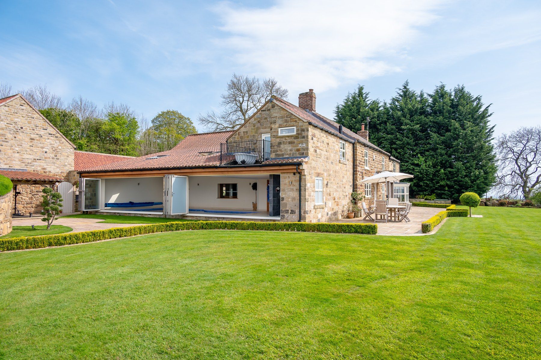 The pool wing and terrace from the garden