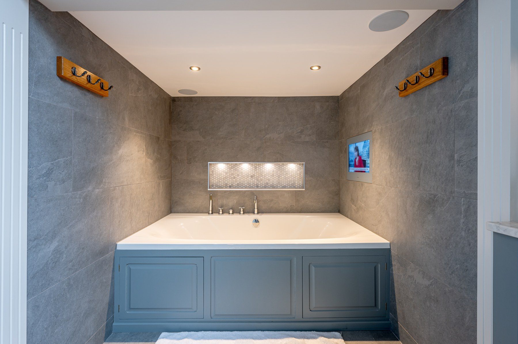 Slate bathroom with deep panelled bath