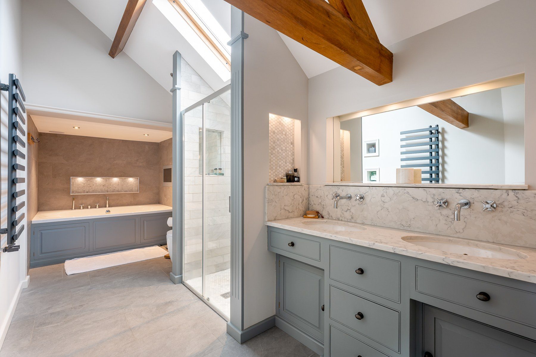 En-suite with double vanity and marble surfaces