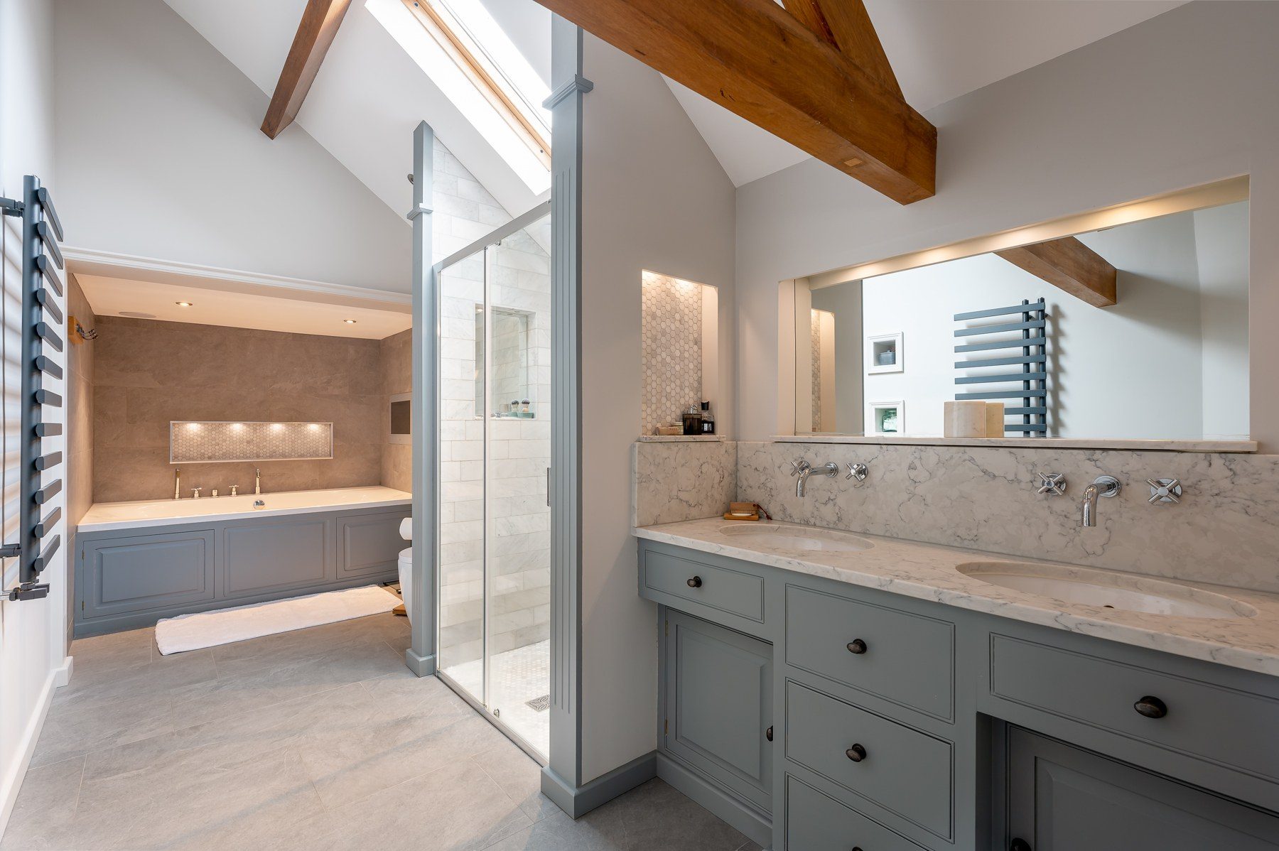 En-suite with walk-in shower, bath and twin basins